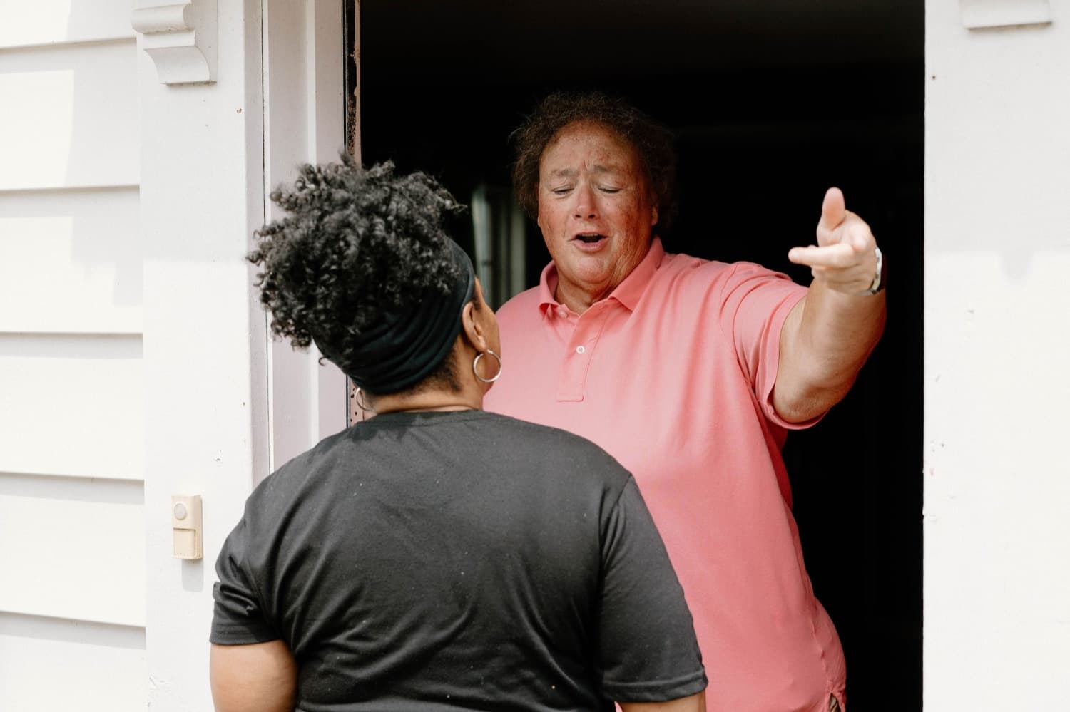 She Does Hauling crew greeting a customer at their door